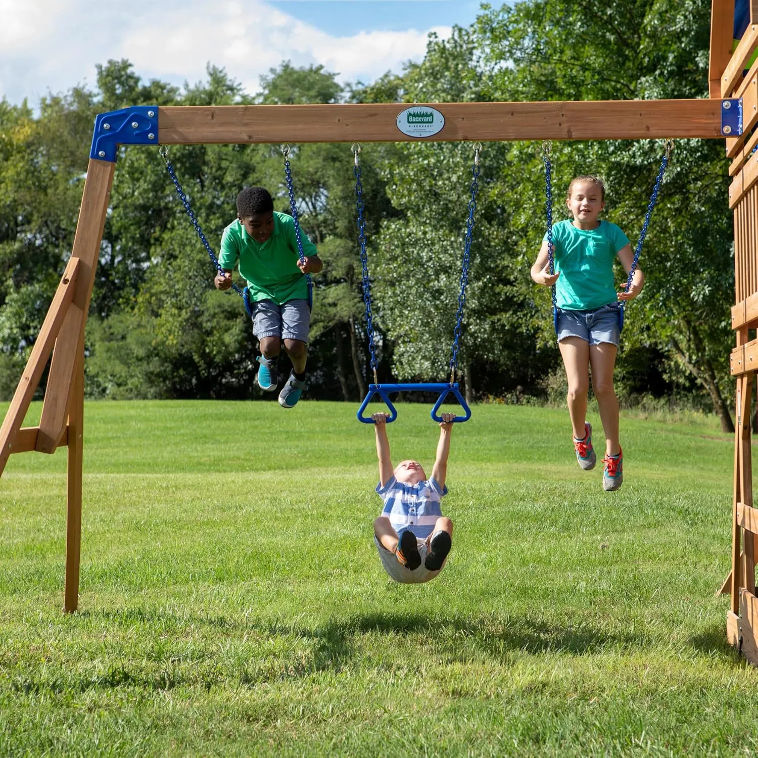 Backyard Discovery Beach Front Cedar Wood Swing Set with Wave Slide, Play Deck, Monkey Bars, Rock Wall Ladder, Shaded Picnic Area, Snack Bar, Belt Swings, Trapeze, Sandbox Area, Outdoor Playset